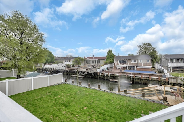 dock area featuring a water view and a residential view