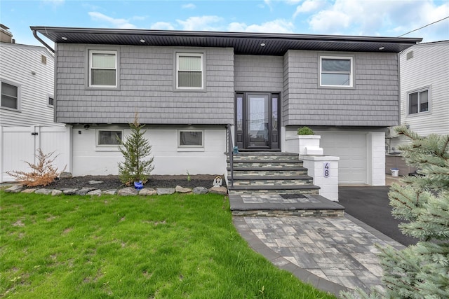 view of front of house with an attached garage and driveway