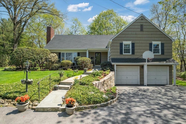 15 Scarsdale Farm Rd, Scarsdale, NY 10583 - split level home with a front yard, a shingled roof, a chimney, aphalt driveway, and an attached garage