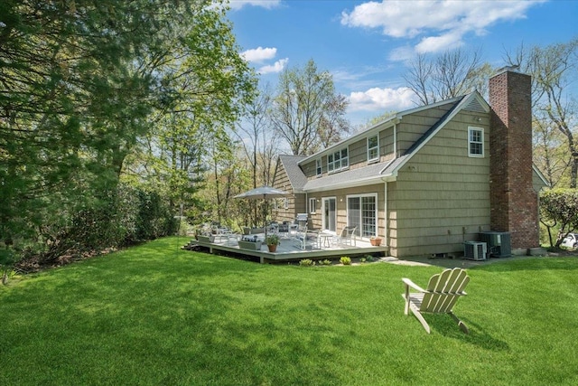 15 Scarsdale Farm Rd, Scarsdale, NY 10583 - rear view of property with a wooden deck, a yard, central AC, and a chimney