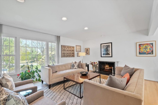 15 Scarsdale Farm Rd, Scarsdale, NY 10583 - living area with recessed lighting, a warm lit fireplace, and light wood-style flooring