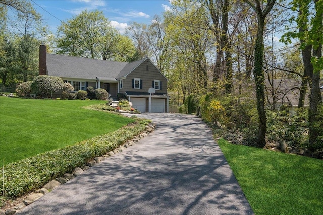 15 Scarsdale Farm Rd, Scarsdale, NY 10583 - view of front of property with driveway, a front lawn, a chimney, and an attached garage