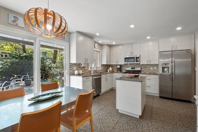 15 Scarsdale Farm Rd, Scarsdale, NY 10583 - kitchen with decorative backsplash, white cabinets, a sink, appliances with stainless steel finishes, and dark countertops