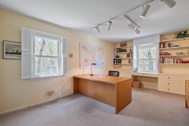 15 Scarsdale Farm Rd, Scarsdale, NY 10583 - home office with built in desk, track lighting, light carpet, and visible vents