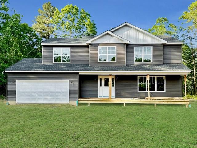 403 Moriches-Middle Island Rd, Manorville, NY 11949 - view of front of house with a front lawn, covered porch, a garage, and roof with shingles