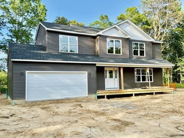 403 Moriches-Middle Island Rd, Manorville, NY 11949 - view of front of house with a porch, driveway, and an attached garage