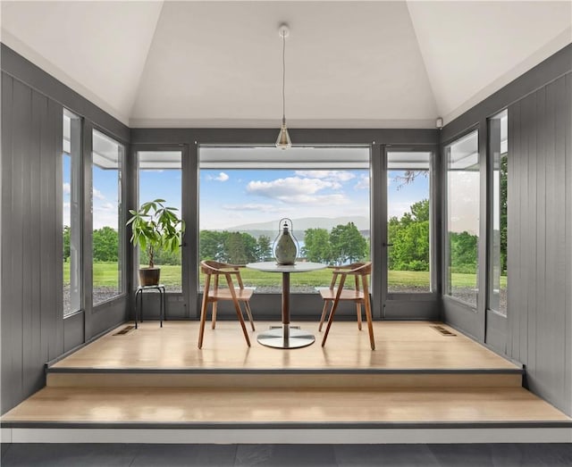 sunroom with visible vents and vaulted ceiling
