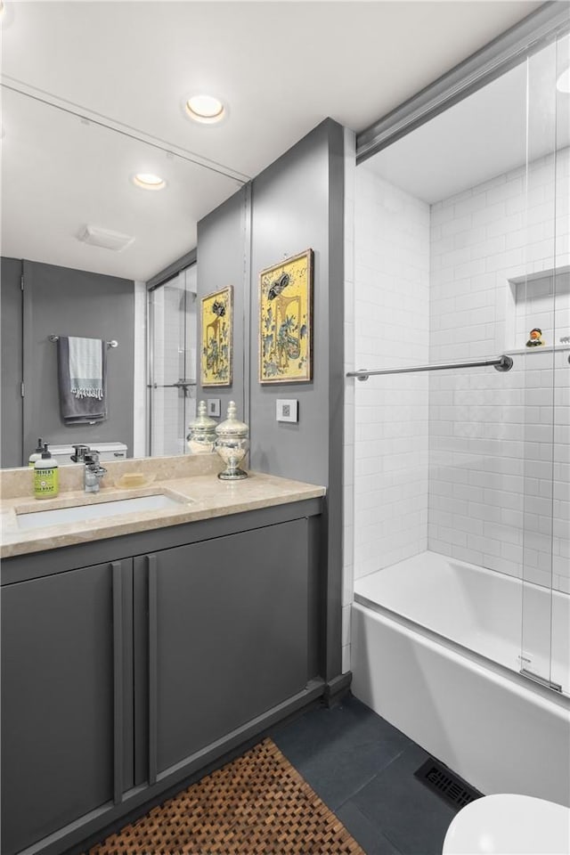 full bath with visible vents, toilet, vanity, tile patterned flooring, and bathing tub / shower combination