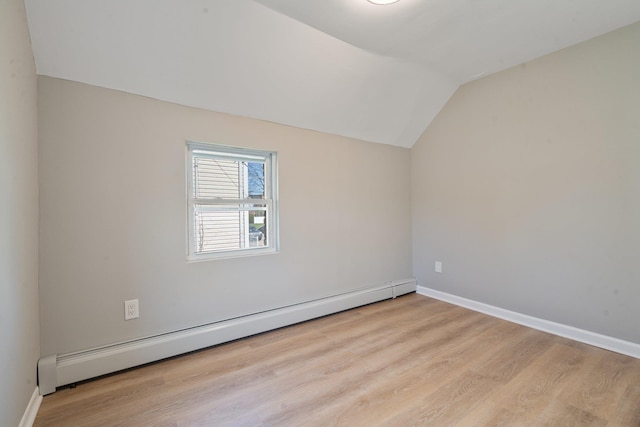 208 Newport Rd, Uniondale, NY 11553 - bonus room featuring baseboards, a baseboard radiator, vaulted ceiling, and wood finished floors
