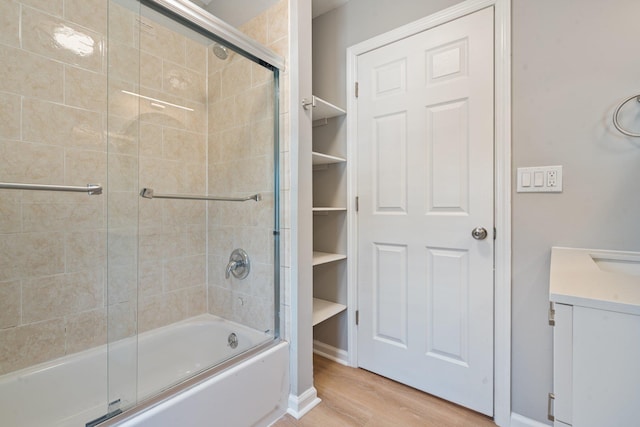 208 Newport Rd, Uniondale, NY 11553 - full bath with enclosed tub / shower combo and wood finished floors