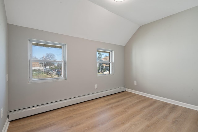 208 Newport Rd, Uniondale, NY 11553 - additional living space featuring baseboards, lofted ceiling, wood finished floors, and baseboard heating