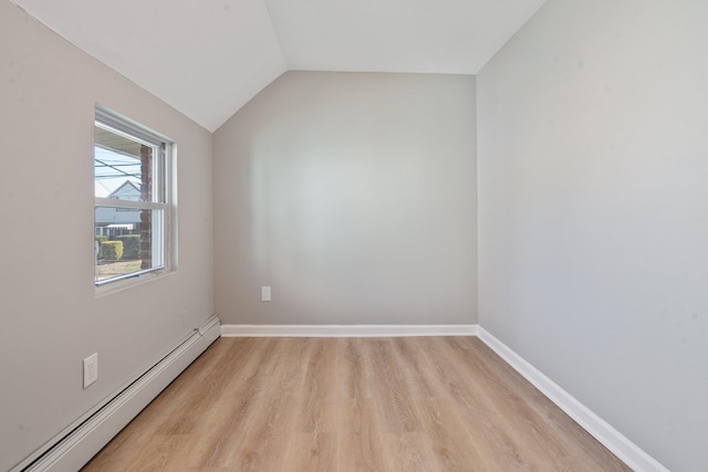 208 Newport Rd, Uniondale, NY 11553 - unfurnished room with light wood-type flooring, a baseboard heating unit, baseboards, and lofted ceiling