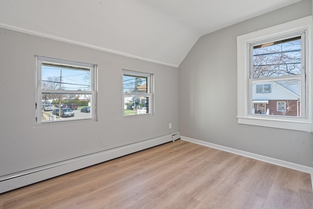 208 Newport Rd, Uniondale, NY 11553 - interior space featuring a baseboard radiator, light wood-type flooring, a wealth of natural light, and lofted ceiling