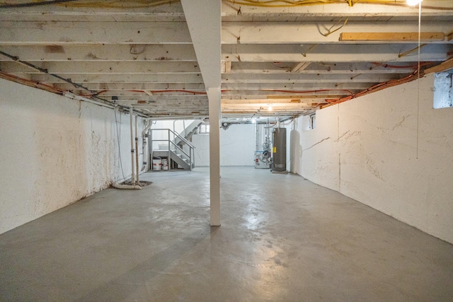 208 Newport Rd, Uniondale, NY 11553 - unfinished below grade area featuring water heater and stairway