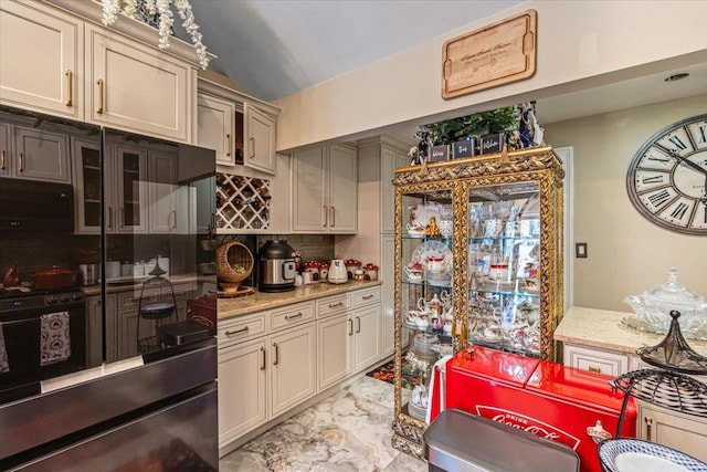 25 Snyder St, Patchogue, NY 11772 - kitchen featuring marble finish floor, light stone counters, decorative backsplash, and black appliances