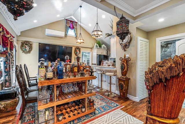 25 Snyder St, Patchogue, NY 11772 - dining space featuring a wall mounted AC, ornamental molding, recessed lighting, lofted ceiling, and wood finished floors