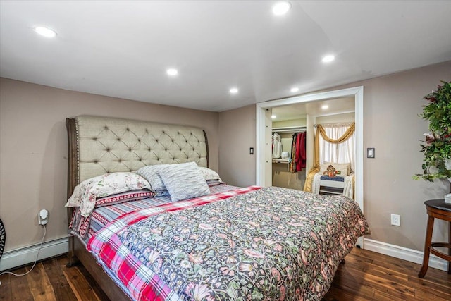 25 Snyder St, Patchogue, NY 11772 - bedroom featuring wood finished floors, a baseboard heating unit, baseboards, and recessed lighting