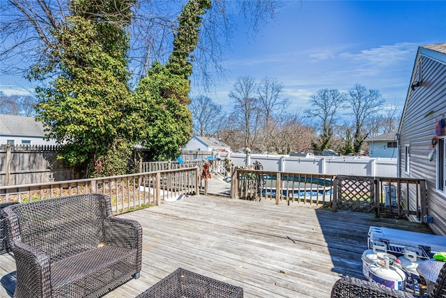 25 Snyder St, Patchogue, NY 11772 - wooden deck with a fenced backyard and a fenced in pool