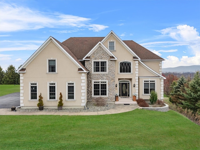 90 Lattintown Rd, Newburgh, NY 12550 - view of front of house featuring a front lawn, stone siding, and stucco siding