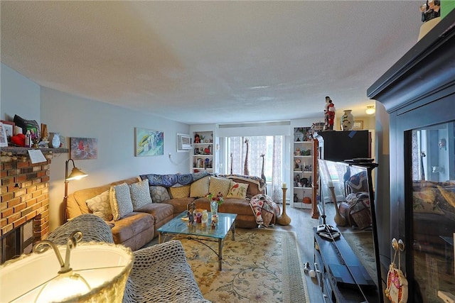 living area featuring wood finished floors and a brick fireplace