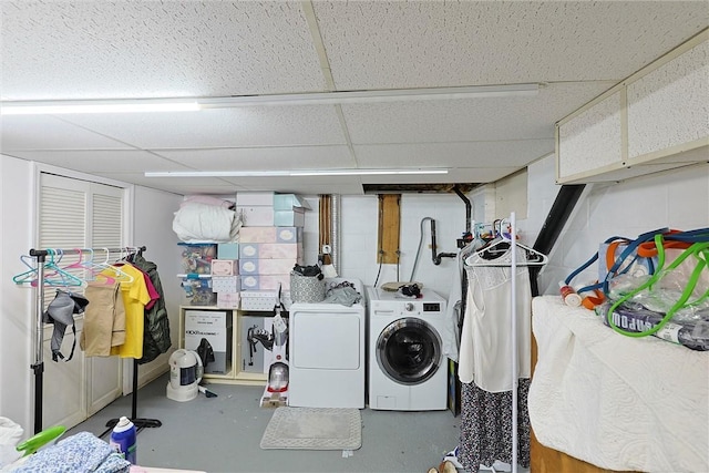 washroom featuring washer and dryer and laundry area
