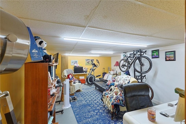 exercise room featuring a paneled ceiling