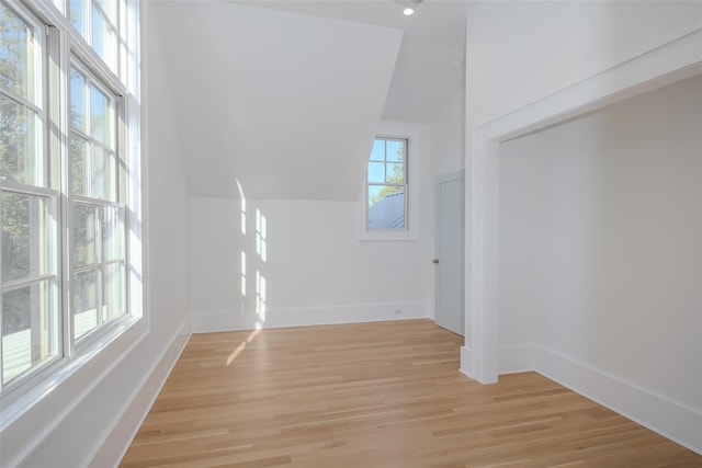 139A N Ferry Rd, Shelter Island, NY 11964 - empty room featuring light wood finished floors, vaulted ceiling, and baseboards