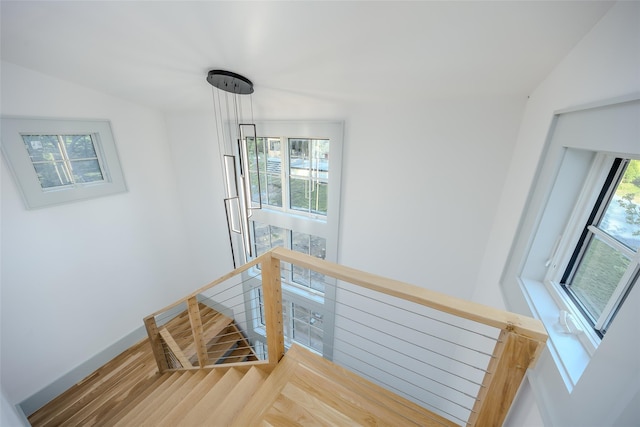 139A N Ferry Rd, Shelter Island, NY 11964 - stairway featuring vaulted ceiling, wood finished floors, and baseboards