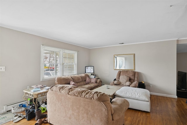living area featuring wood-type flooring, baseboards, crown molding, and visible vents