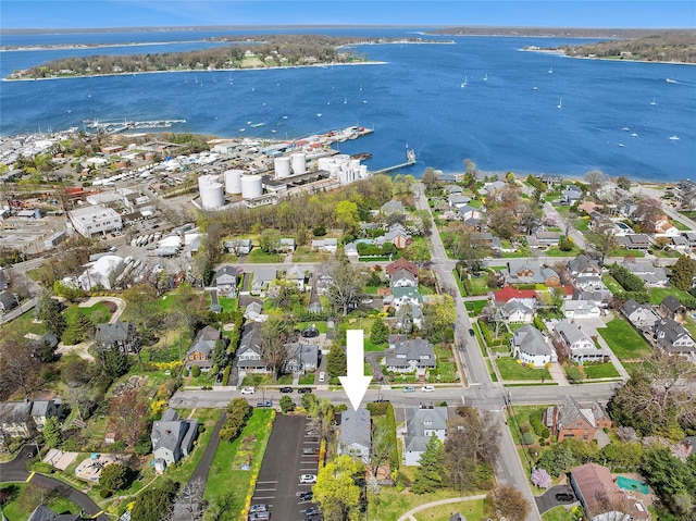 drone / aerial view featuring a water view and a residential view