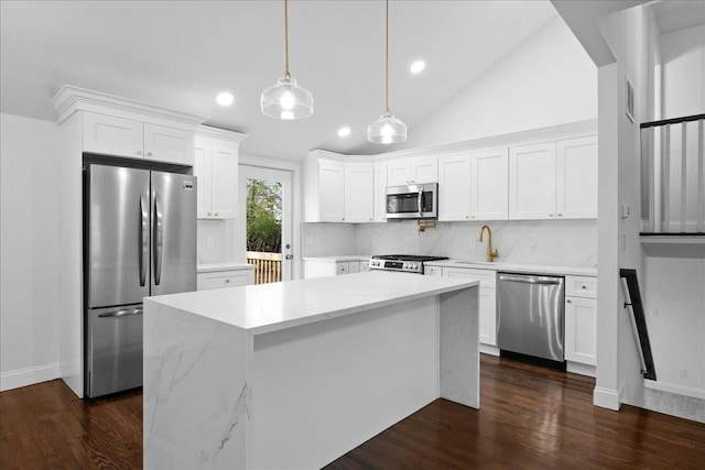 kitchen featuring tasteful backsplash, stainless steel appliances, recessed lighting, and white cabinets