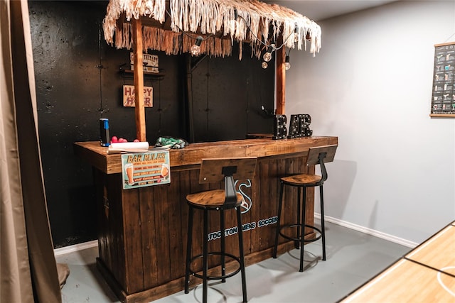 bar with a bar and baseboards