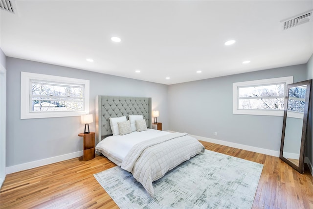16 Huckleberry Ln, Oyster Bay, NY 11771 - bedroom with visible vents, baseboards, and multiple windows
