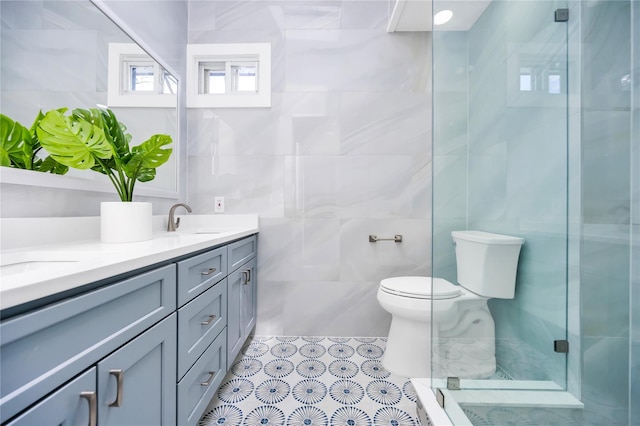 16 Huckleberry Ln, Oyster Bay, NY 11771 - full bath with double vanity, toilet, a sink, tile walls, and a stall shower