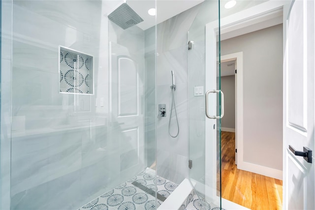 16 Huckleberry Ln, Oyster Bay, NY 11771 - full bath with baseboards, a stall shower, and wood finished floors