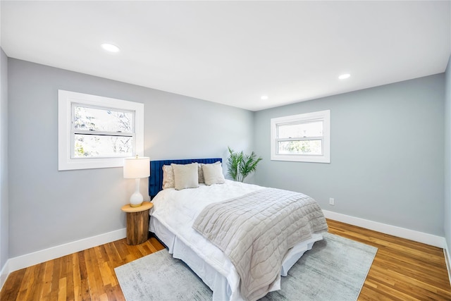 16 Huckleberry Ln, Oyster Bay, NY 11771 - bedroom with recessed lighting, wood finished floors, and baseboards