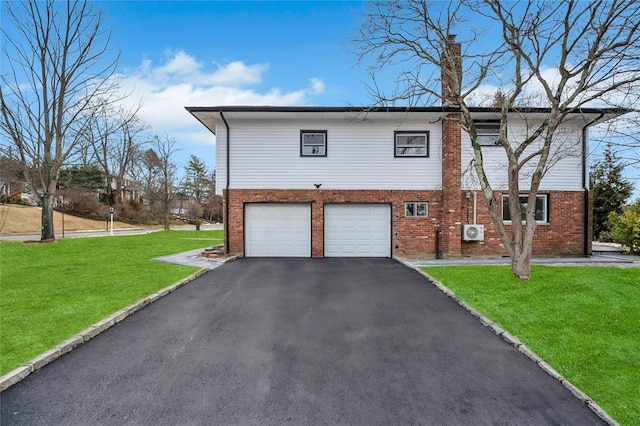 16 Huckleberry Ln, Oyster Bay, NY 11771 - view of side of home featuring aphalt driveway, brick siding, and a garage