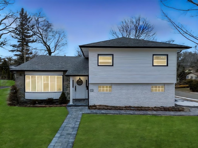16 Huckleberry Ln, Oyster Bay, NY 11771 - split level home featuring roof with shingles and a front lawn
