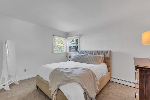 bedroom with ornamental molding, a baseboard heating unit, baseboards, and carpet flooring