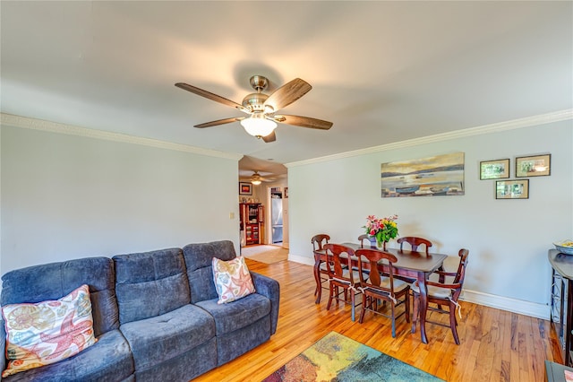 1600 Grand Ave Unit T2, Baldwin, NY 11510 - living area with crown molding, ceiling fan, baseboards, and wood finished floors