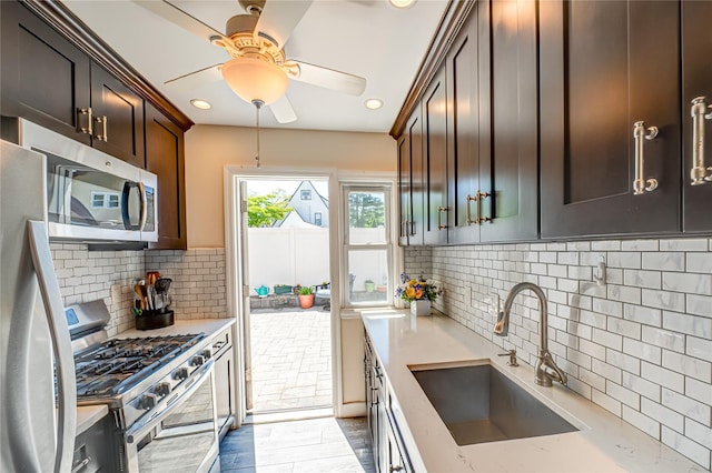 1600 Grand Ave Unit T2, Baldwin, NY 11510 - kitchen with stainless steel appliances, a sink, tasteful backsplash, a ceiling fan, and recessed lighting