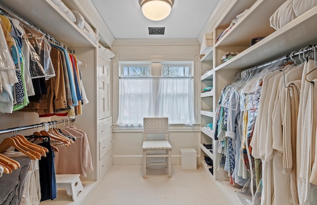 spacious closet featuring carpet flooring and visible vents
