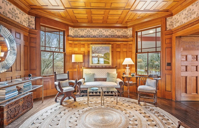 sitting room with plenty of natural light, wood ceiling, and wood finished floors