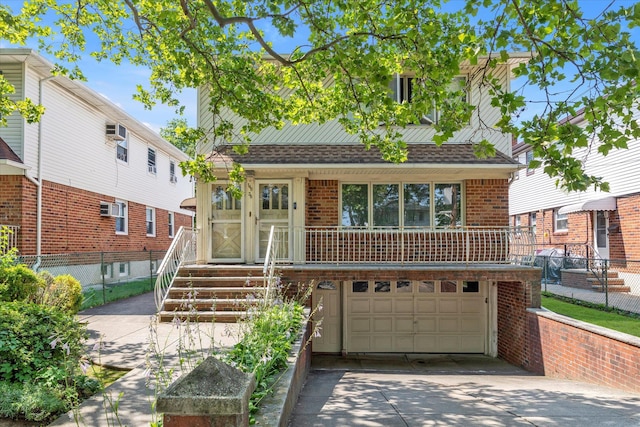 146-38 26th Ave, Flushing, NY 11354 - view of front of house with a garage, concrete driveway, brick siding, and roof with shingles
