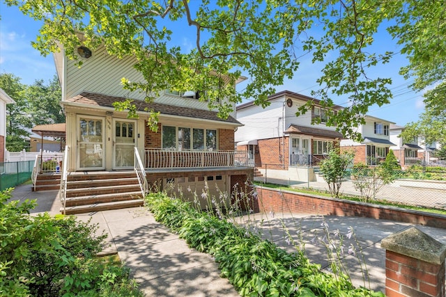 146-38 26th Ave, Flushing, NY 11354 - view of front of home featuring brick siding, a garage, and concrete driveway