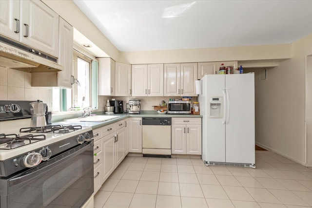 146-38 26th Ave, Flushing, NY 11354 - kitchen with white appliances, under cabinet range hood, tasteful backsplash, and light tile patterned floors