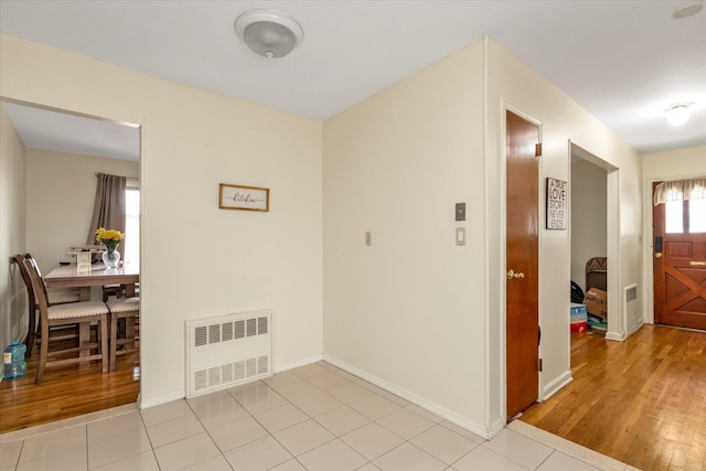 146-38 26th Ave, Flushing, NY 11354 - hallway featuring radiator heating unit and light wood-type flooring