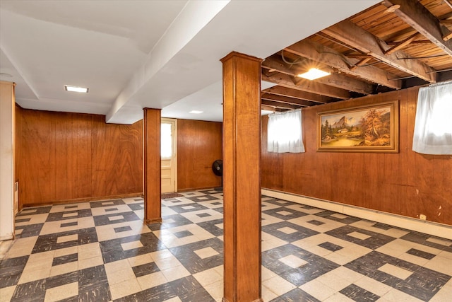 146-38 26th Ave, Flushing, NY 11354 - basement with tile patterned floors, wood walls, and a baseboard radiator