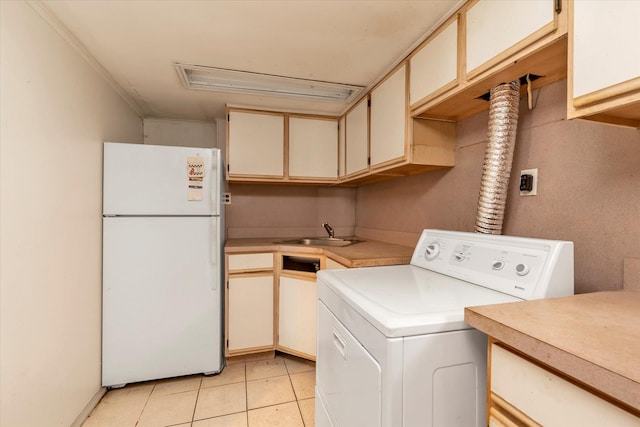 146-38 26th Ave, Flushing, NY 11354 - laundry room with washer / clothes dryer, cabinet space, and light tile patterned floors