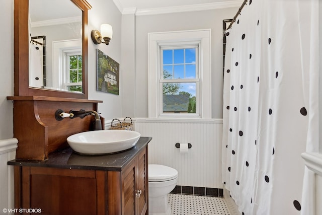 full bathroom with wainscoting, ornamental molding, toilet, vanity, and curtained shower